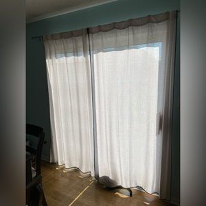 Cream and grey curtains with rods